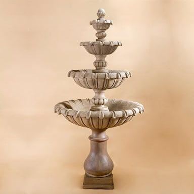 Grand Chateau Four Tier Fountain against brown background.