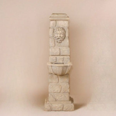 Green Man Column Fountain against brown background.