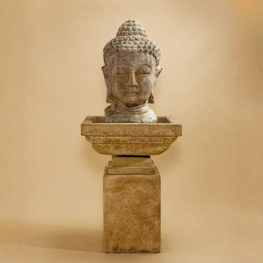 Meditation Buddha Fountain, Tall against brown background.