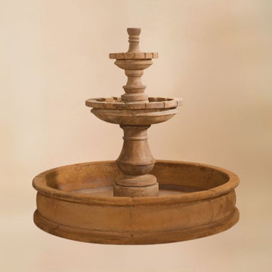 Montefalco Two Tier Pond Fountain against brown background.
