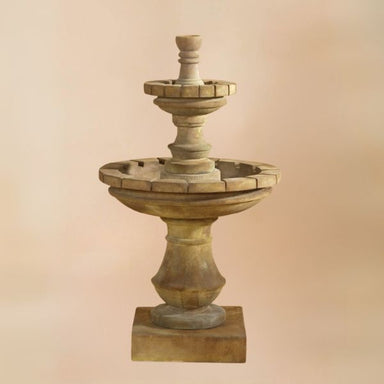 Montefalco Two Tier Small Fountain against brown background.