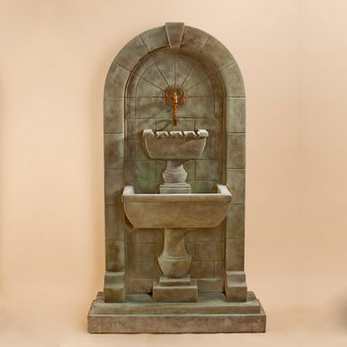 Monterosso Wall Fountain against brown background.