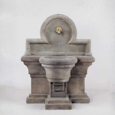 Porta Romana Wall Fountain for spout against gray background.