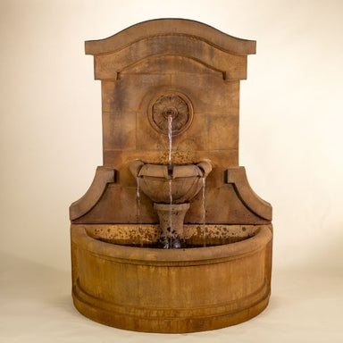Portofino Wall Fountain against brown background.