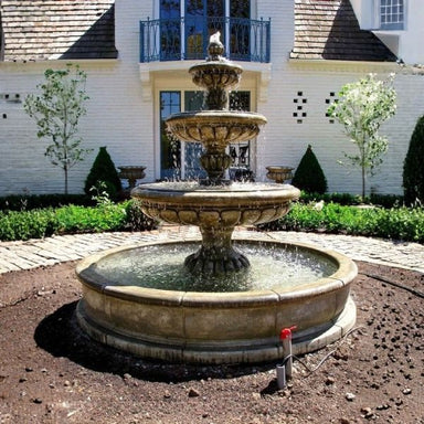 Provence Three Tier Pond Fountain in action against the white house.