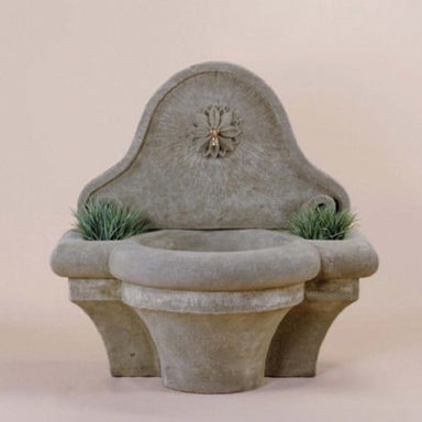Provence Wall Fountain for spout against brown background.