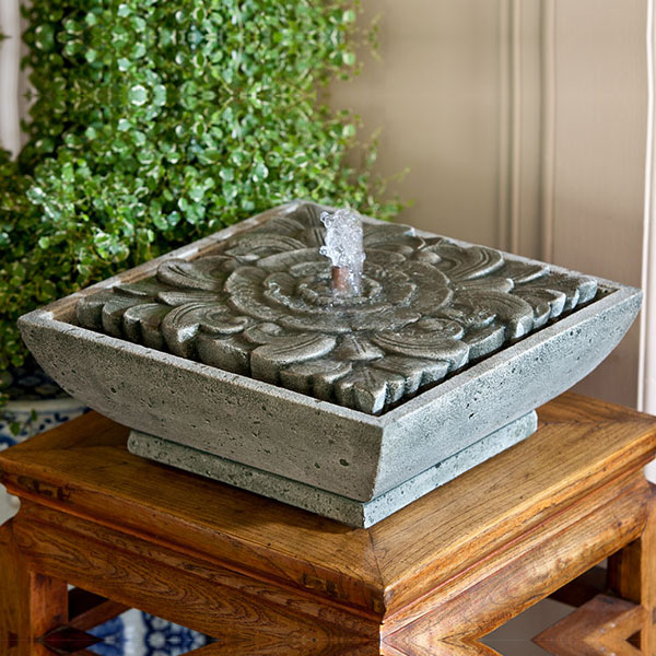 M-Series Artifact Fountain on table against green plants