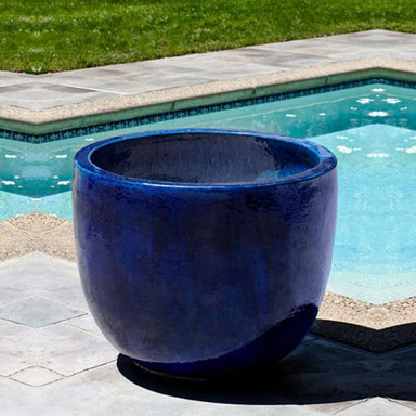 Sem Planter - Riviera Blue Set of 4 beside swimming pool in the backyard