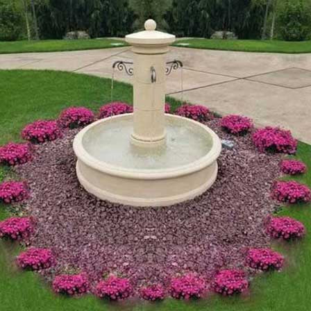 Avignon Fountain surrounded by pink flowers in backyard