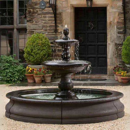 Caterina Fountain in basin in action in front of house