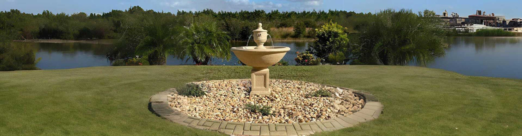 Rochefort fountain in action on white pebbles