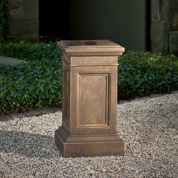 Garden Pedestals Collection Image of Coachhouse Pedestal on gravel in the backyard.