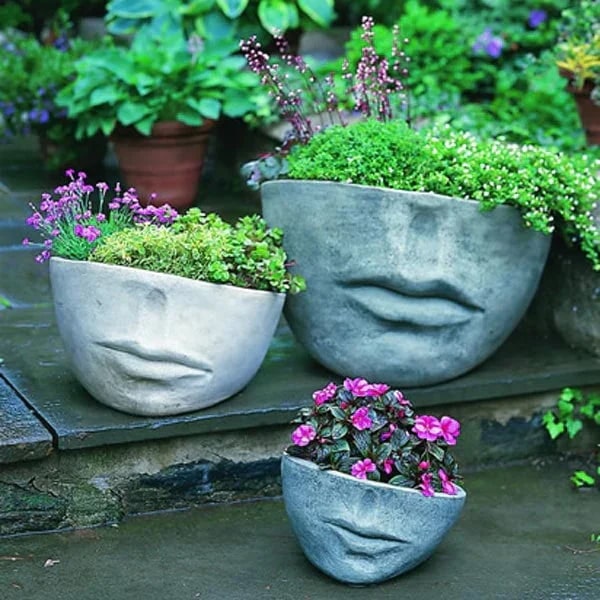 Campania Faccia Planters filled with plants on patio