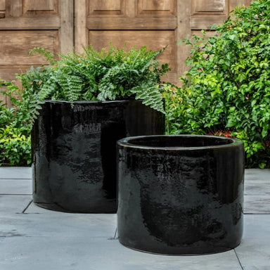 360 Planter S/2 on concrete filled with plants.