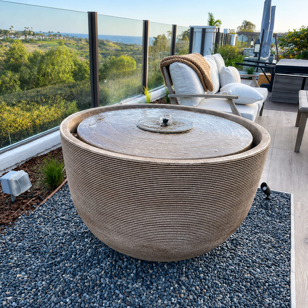 Alta Girona Fountain in brownstone color on deck overlooking pacific ocean.