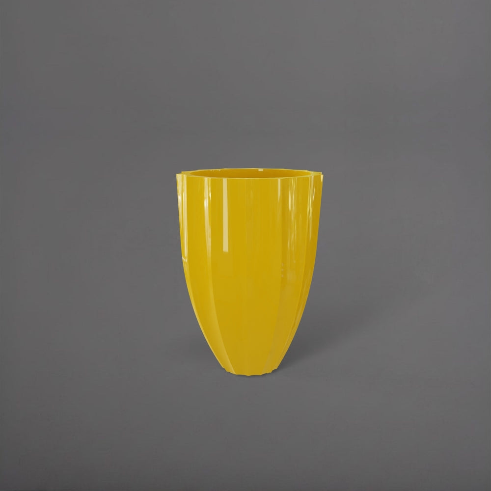 Alicante Tapered Fluted Round Fiberglass Planter in gloss saffron against gray background.