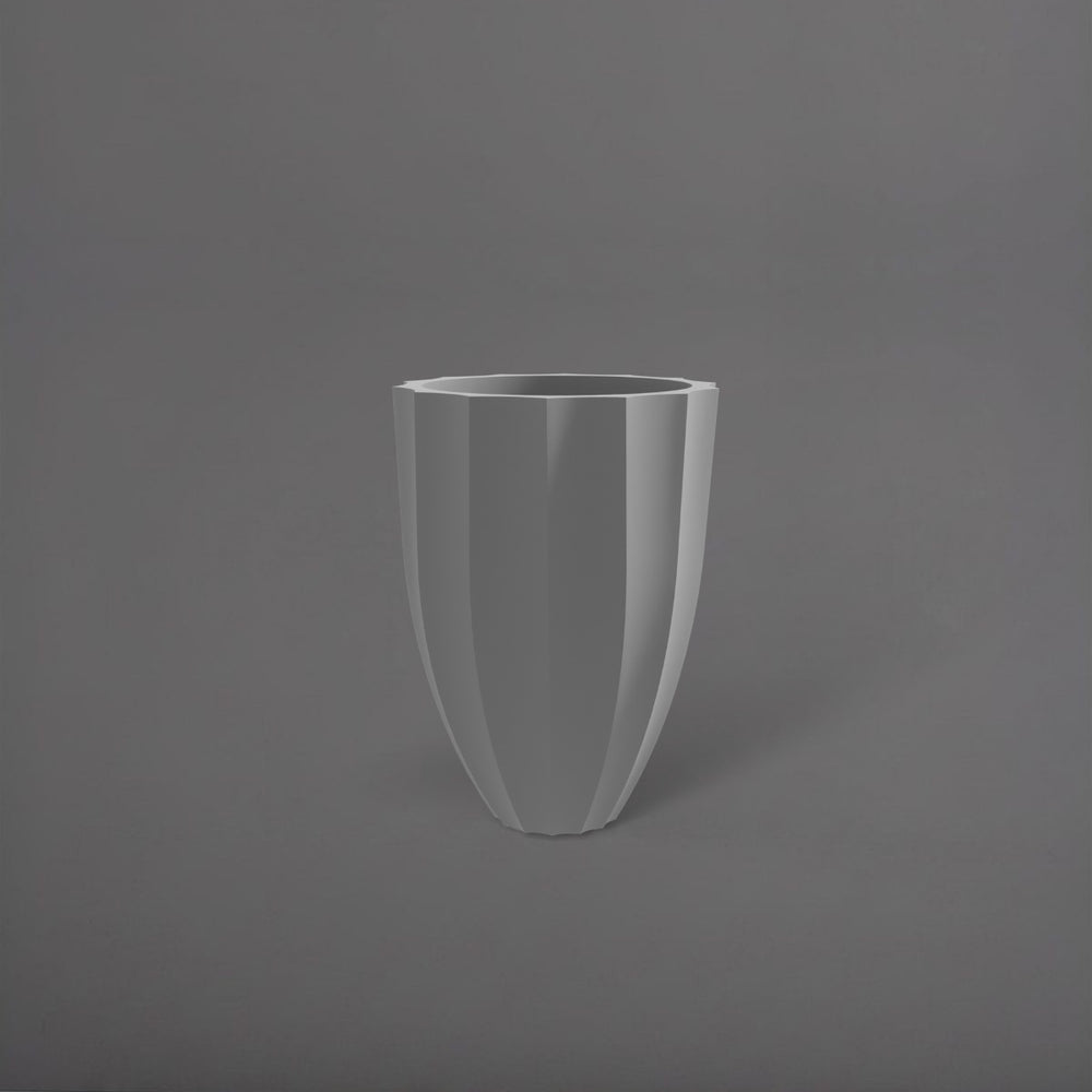 Alicante Tapered Fluted Round Fiberglass Planter in matte cement grey against gray background.