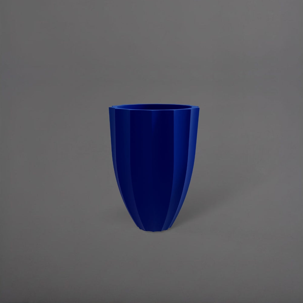 Alicante Tapered Fluted Round Fiberglass Planter in matte cobalt blue against gray background.