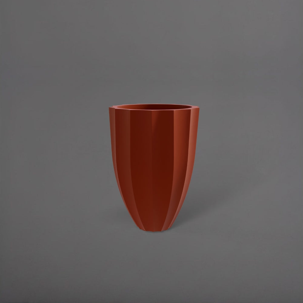 Alicante Tapered Fluted Round Fiberglass Planter in matte terra cotta against gray background.