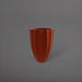 Alicante Tapered Fluted Round Fiberglass Planter in matte terra cotta against gray background.