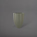 Alicante Tapered Fluted Round Fiberglass Planter in satin beige against gray background.