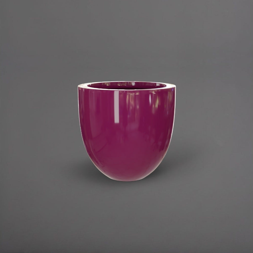 Alzira Round Fiberglass Planter in gloss eggplant against gray background.
