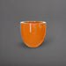 Alzira Round Fiberglass Planter in gloss tangerine against gray background.