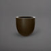 Alzira Round Fiberglass Planter in matte bronze against gray background.