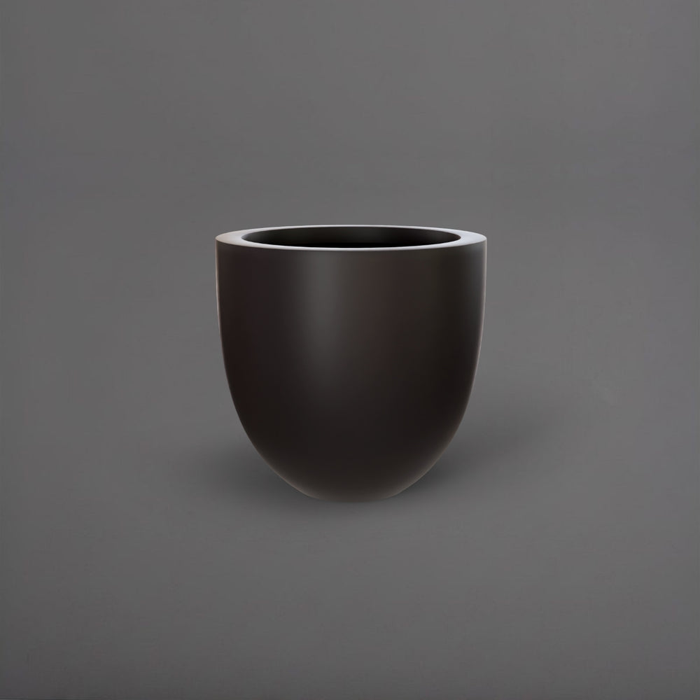 Alzira Round Fiberglass Planter in matte charcoal against gray background.