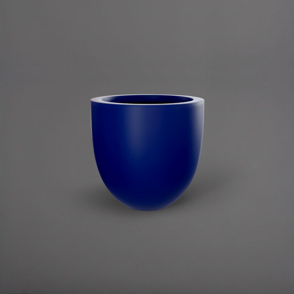 Alzira Round Fiberglass Planter in matte cobalt blue against gray background.