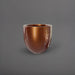 Alzira Round Fiberglass Planter in metallic bronze against gray background.