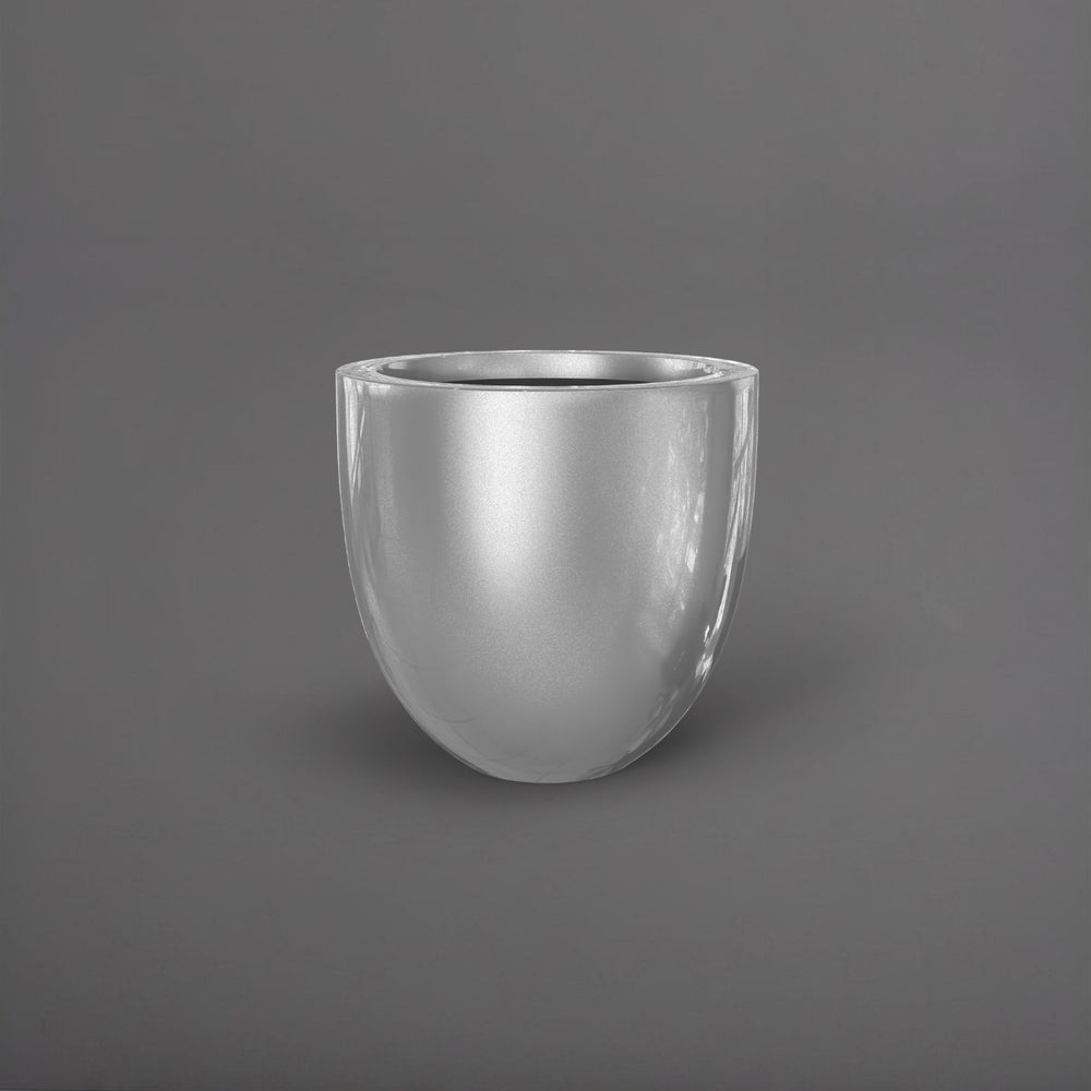 Alzira Round Fiberglass Planter in metallic silver against gray background.