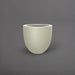 Alzira Round Fiberglass Planter in satin beige against gray background.