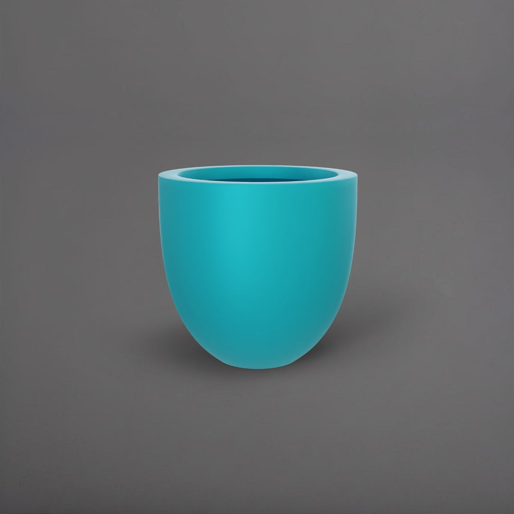 Alzira Round Fiberglass Planter in satin seafoam green against gray background.