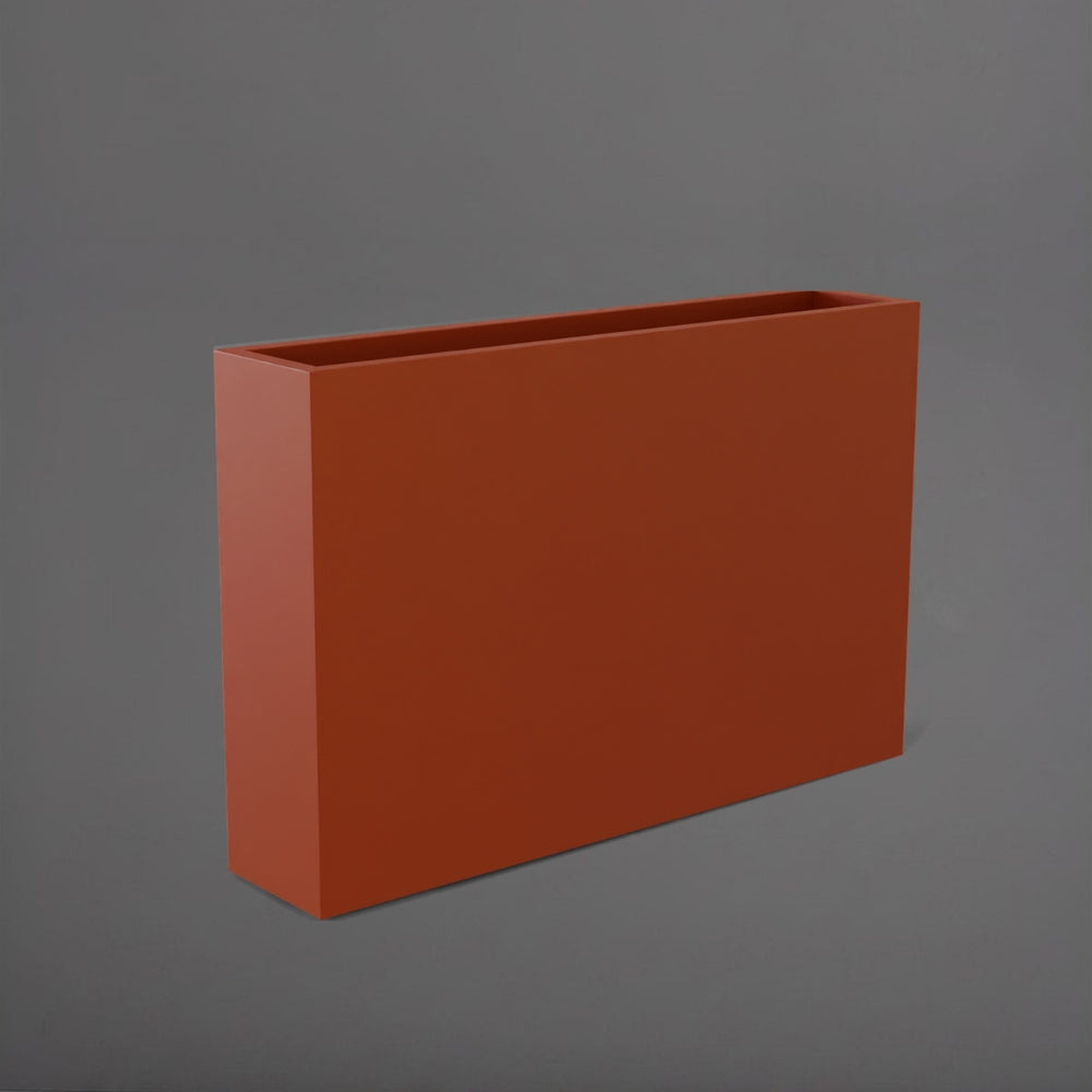 Amesbury Narrow Rectangle Planter in matte terra cotta against gray background.