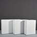 Amesbury Narrow Rectangle Planter on concrete shown in different sizes.