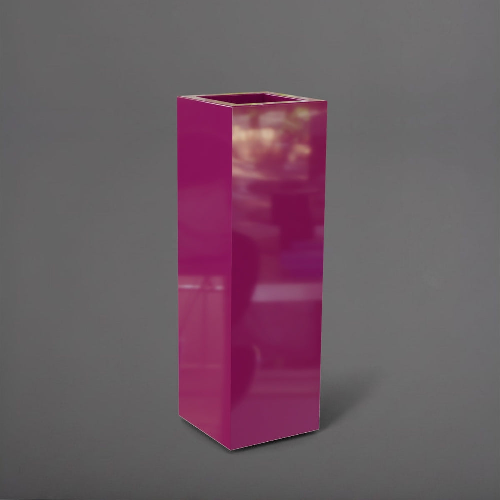 Amesbury Tall Corner Planter in gloss eggplant against gray background.