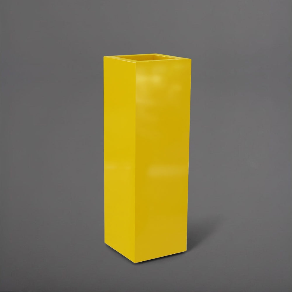 Amesbury Tall Corner Planter in gloss saffron against gray background.