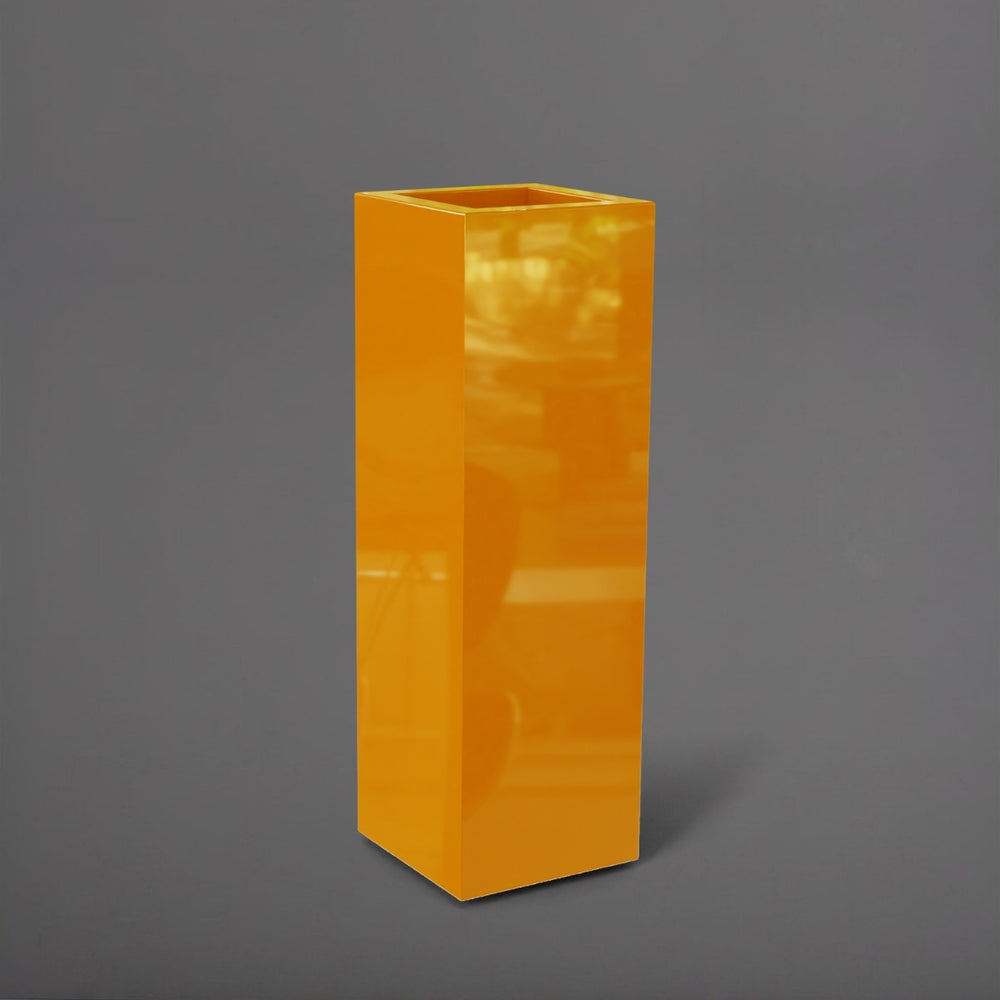 Amesbury Tall Corner Planter in gloss tangerine against gray background.