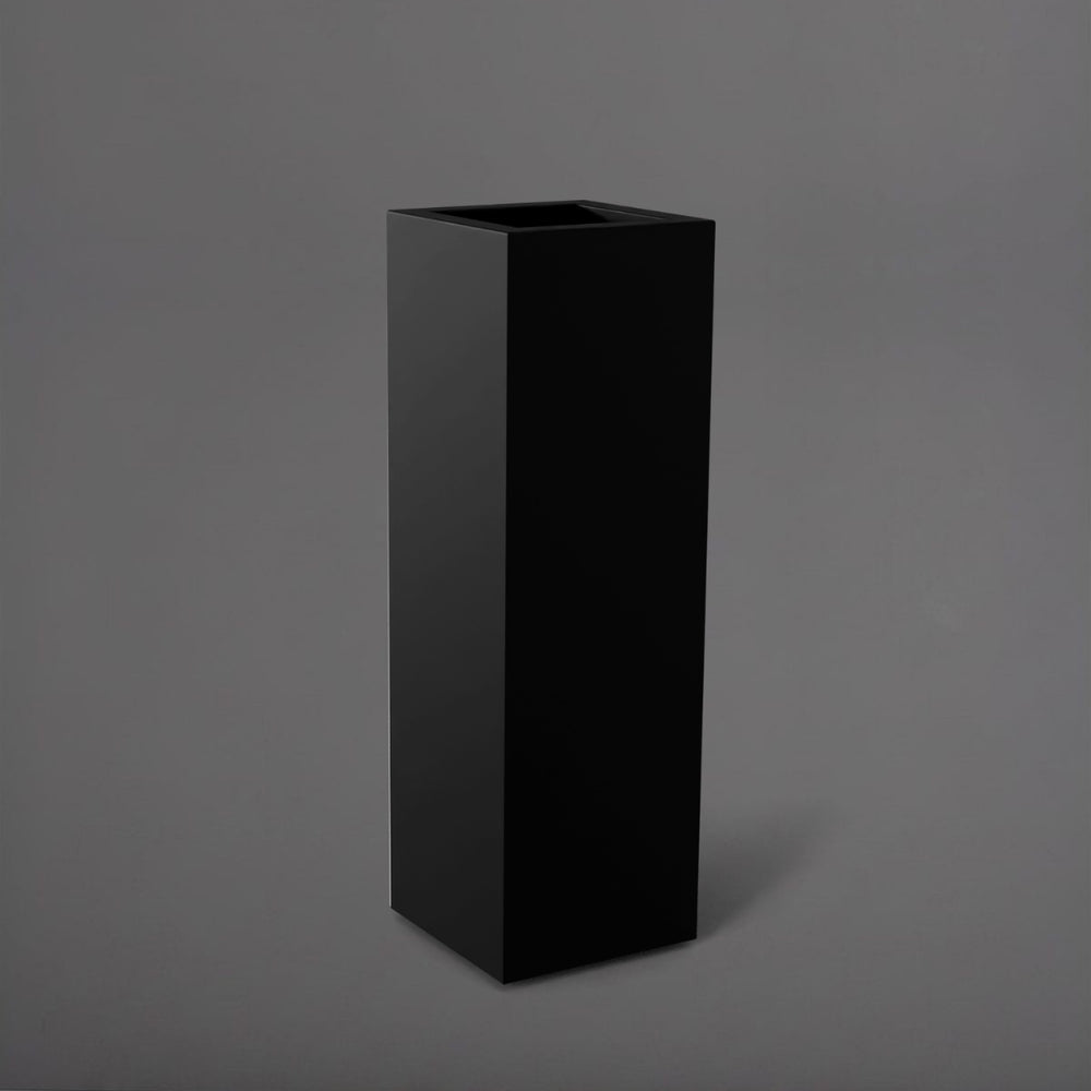 Amesbury Tall Corner Planter in matte black against gray background.