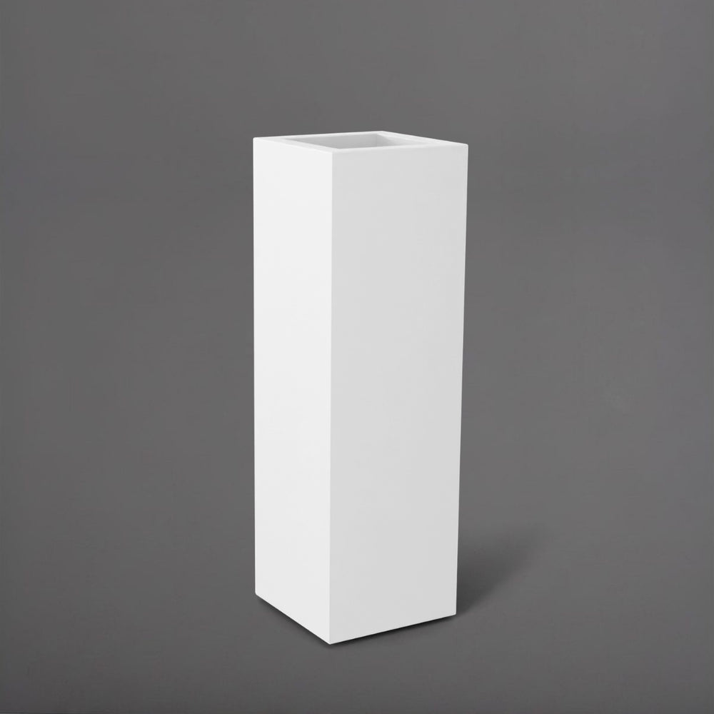 Amesbury Tall Corner Planter in matte bright white against gray background.
