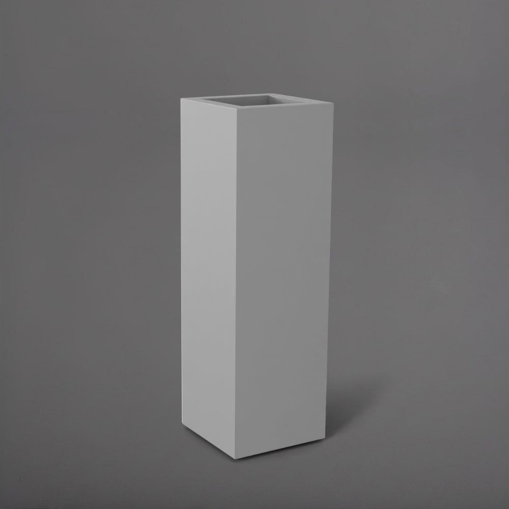Amesbury Tall Corner Planter in matte cement grey against gray background.
