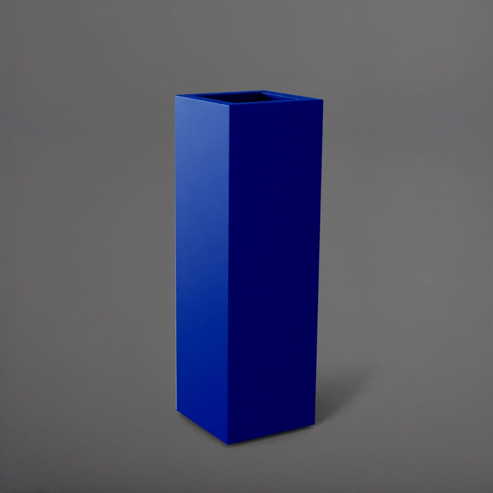 Amesbury Tall Corner Planter in matte cobalt blue against gray background.
