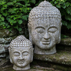 Angkor Buddha Head Large and small angkor grey in the backyard