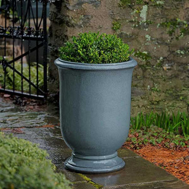 Antibe Urn - French Blue - S/1 on concrete filled with plants