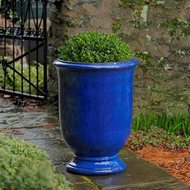 Antibe Urn - Riviera Blue - S/1 on concrete filled with plants