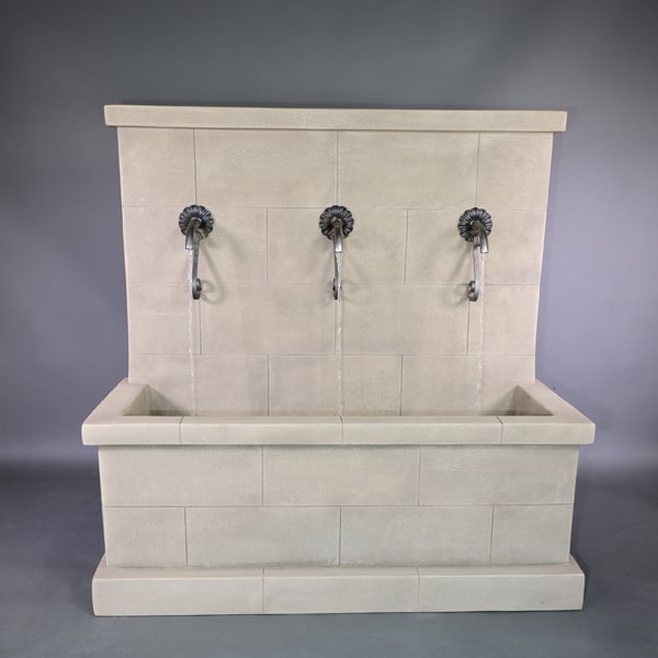 Antibes Trois Wall Fountain in rustic spouts in action.
