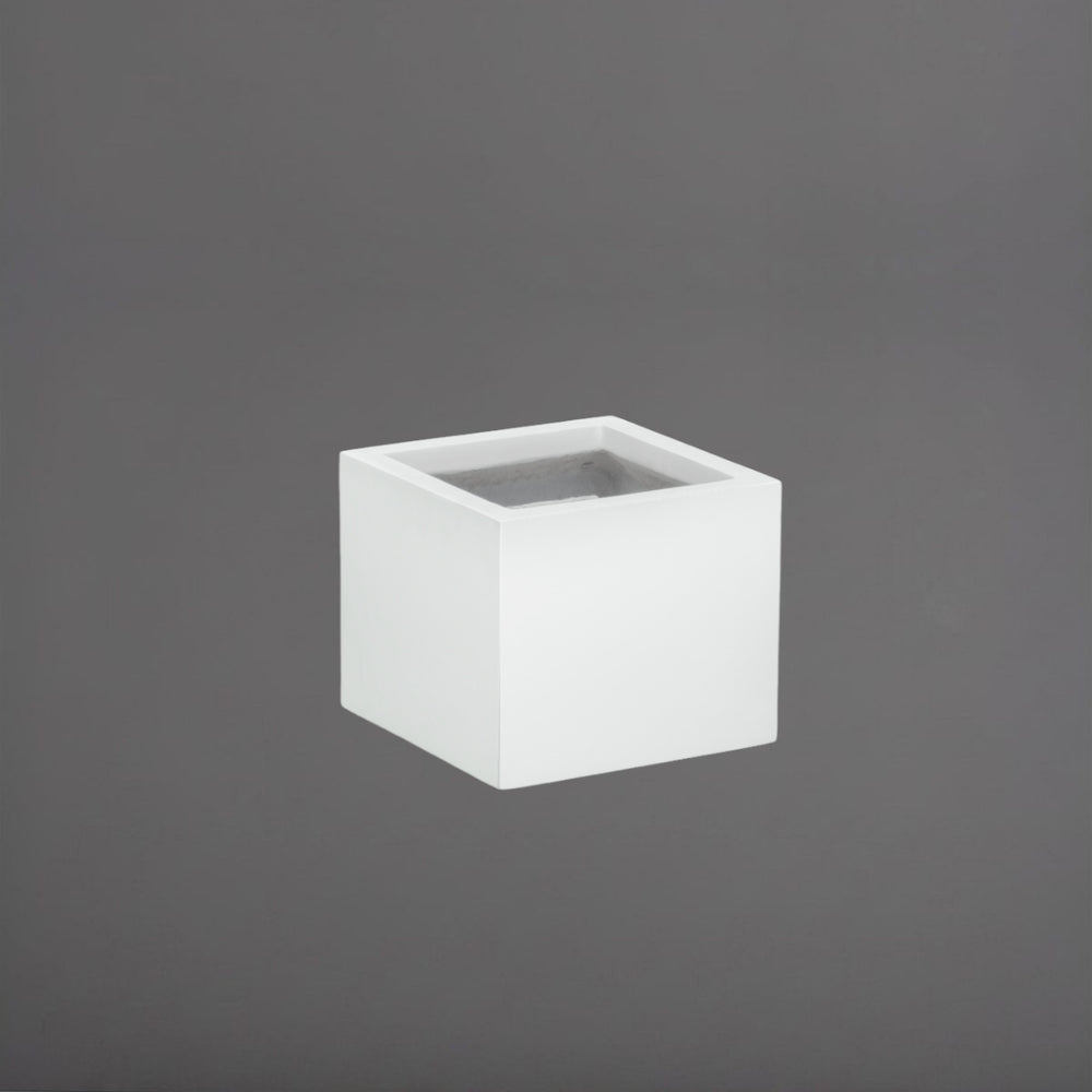 Antwerp Corner Fiberglass Planter in gloss bright white against gray background.