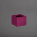 Antwerp Corner Fiberglass Planter in gloss eggplant against gray background.