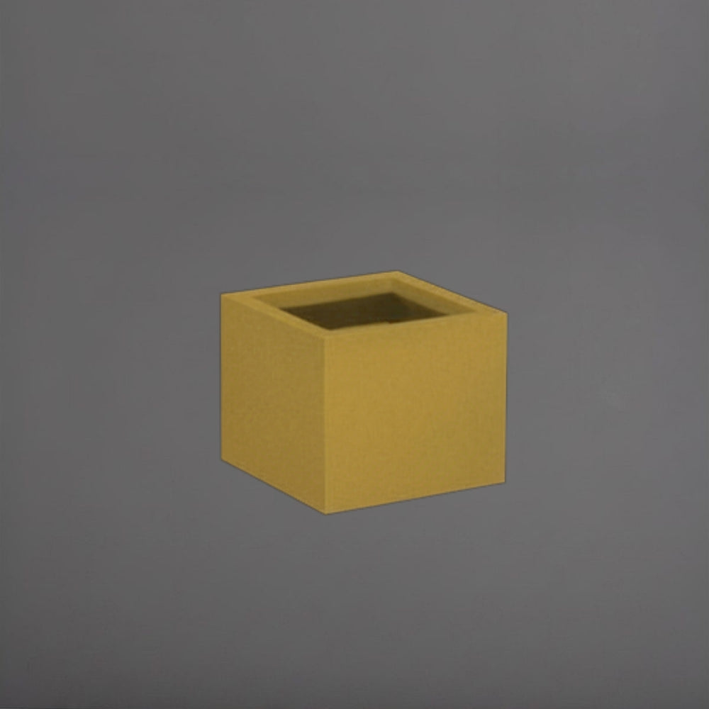 Antwerp Corner Fiberglass Planter in gloss metallic gold against gray background.